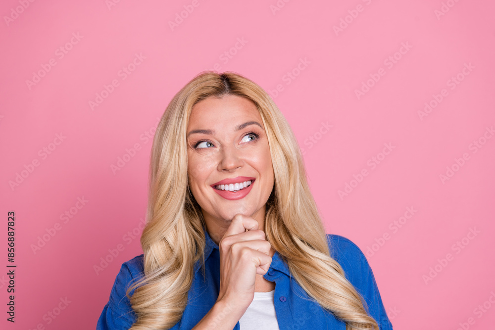 Photo of shiny thoughtful lady dressed blue jacket looking empty space isolated pink color background Photo of shiny thoughtful lady dressed blue jacket looking empty space isolated pink color background