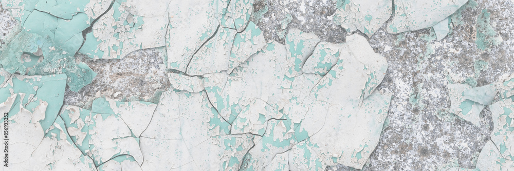 Obraz premium Peeling paint on the wall. Old concrete wall with cracked flaking paint. Weathered rough painted surface with patterns of cracks and peeling. High resolution texture for background and design. Closeup
