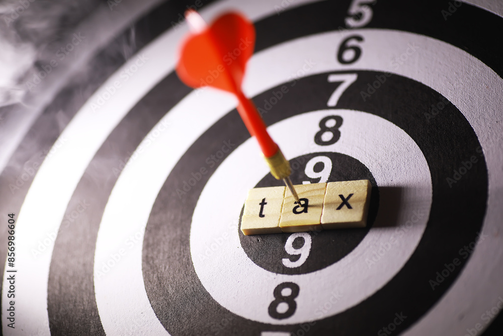 Dart Hitting Bullseye on Tax Blocks in Target - Financial Precision Concept Dart Hitting Bullseye on Tax Blocks in Target - Financial Precision Concept
