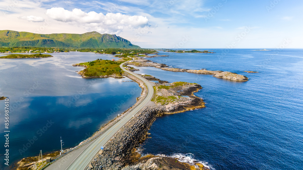 An aerial view of the Atlantic Road in Norway, showcasing its stunning scenery and the road winding its way through the islands. An aerial view of the Atlantic Road in Norway, showcasing its stunning scenery and the road winding its way through the islands.