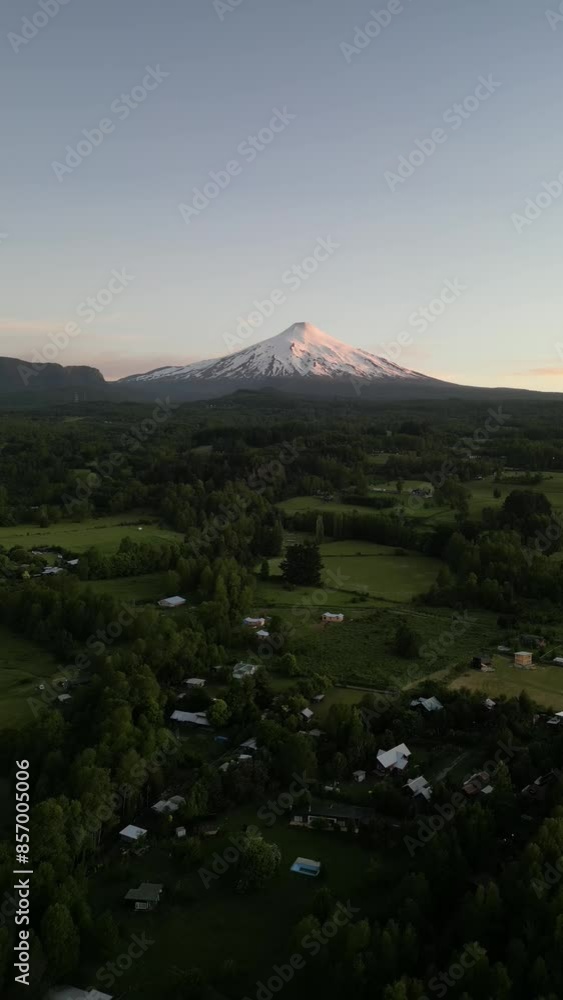 Aerial video over the town of Pocon in the background of the active volcano Villarrica, Chile Aerial video over the town of Pocon in the background of the active volcano Villarrica, Chile