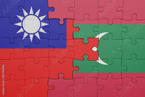 puzzle with the colourful national flag of maldives and flag of taiwan . photo