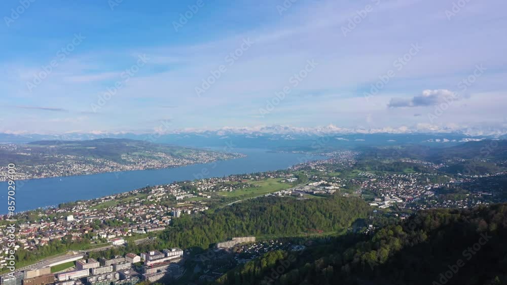 Zurich City, Zurich Lake and Swiss Alps from Uetliberg Mountain on Sunny Day. Switzerland. Aerial View. Drone Moves Forward Zurich City, Zurich Lake and Swiss Alps from Uetliberg Mountain on Sunny Day. Switzerland. Aerial View. Drone Moves Forward