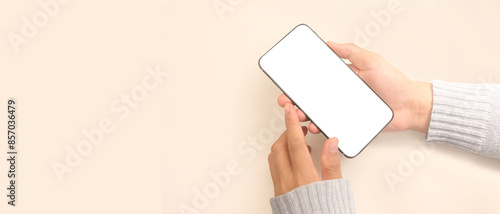 Hand holding smartphone device and touching screen
