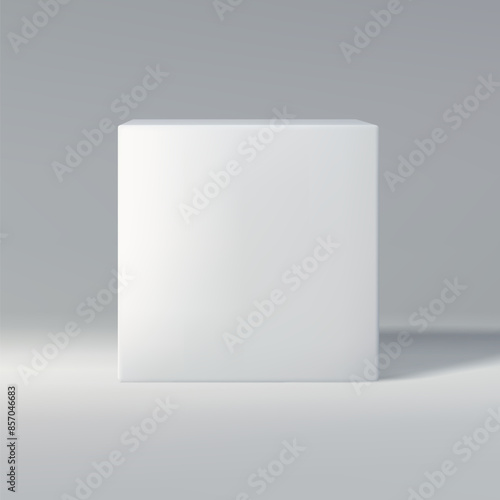 Simple white cube in front view on a gray gradient background, casting shadow.