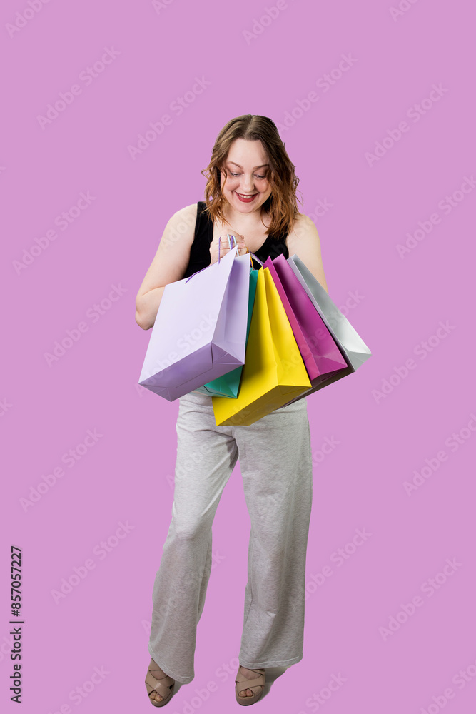 Cheerful woman with packages rejoices at successful purchases at sale. High quality photo Cheerful woman with packages rejoices at successful purchases at sale. High quality photo
