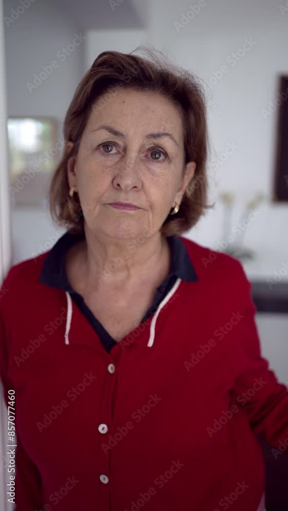 Deep Look - Close-Up Portrait of a Serious Lady Locking Eyes with the Camera With Green Eyes, Wearing Golden Earrings And Red Shirt Deep Look - Close-Up Portrait of a Serious Lady Locking Eyes with the Camera With Green Eyes, Wearing Golden Earrings And Red Shirt