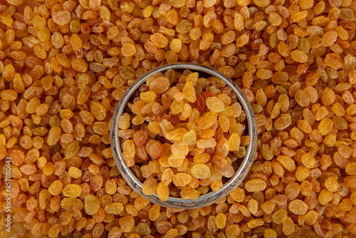 Sultani raisins. Dried golden raisins background. Pile of dried yellow raisins. Organic golden raisins texture. photo