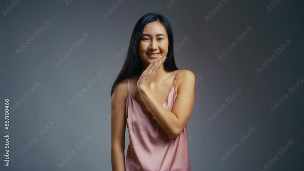 Happy Asian woman enjoying her soft face skin, youth preservation, make-up free Happy Asian woman enjoying her soft face skin, youth preservation, make-up free