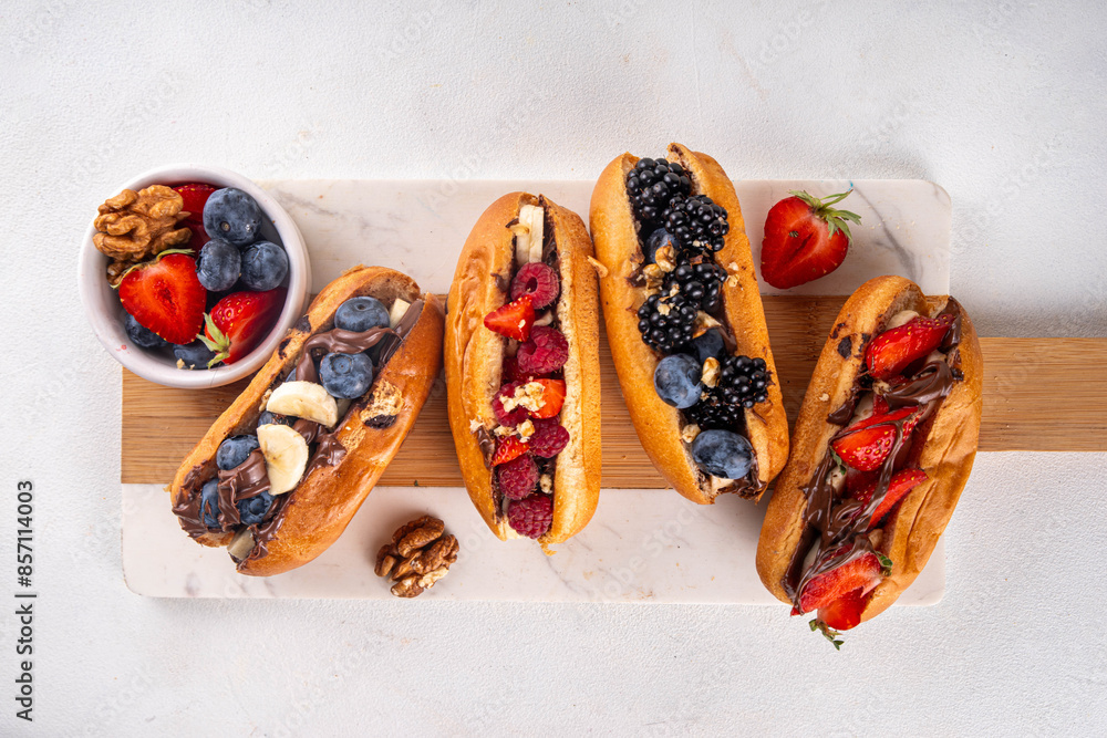 © ricka_kinamoto - Sweet summer fruit berry breakfast sweet hot dogs, dessert leftovers hot dogs with chocolate spread, various fruit, blueberry, raspberry, strawberry, blackberry, nuts