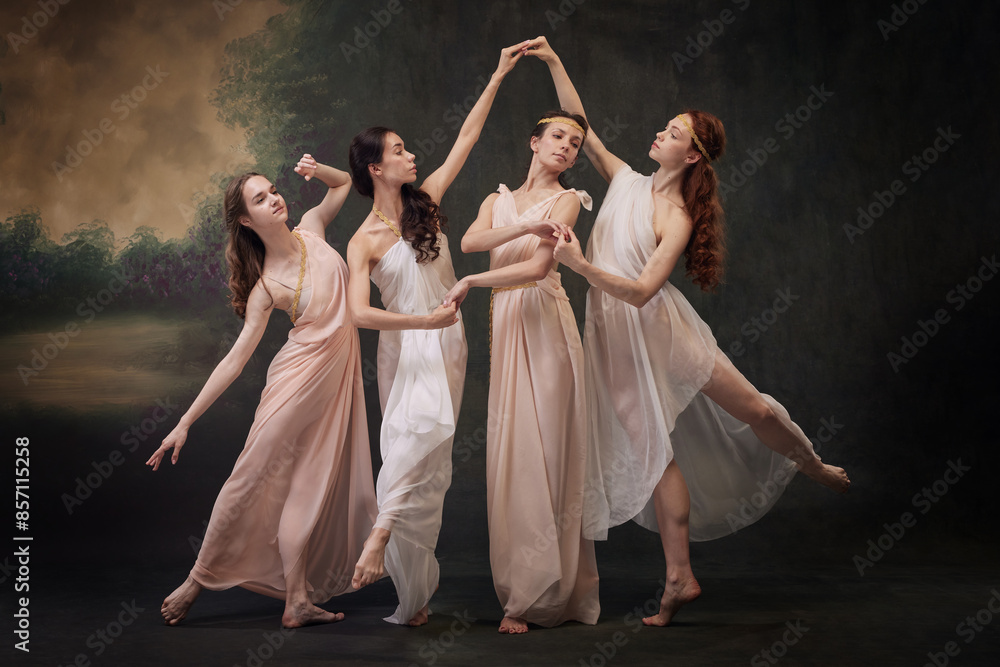 Poetic Movement. Group of dancers in flowing costumes evoke sense of timeless beauty. against vintage studio background. Concept of ballet, history, fusion of modernity and ancient times in art. Poetic Movement. Group of dancers in flowing costumes evoke sense of timeless beauty. against vintage studio background. Concept of ballet, history, fusion of modernity and ancient times in art.