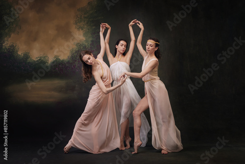 Bild auf Leinwand Women, muses in pastel chiffon dresses perform poetic and expressive dance against vintage studio background