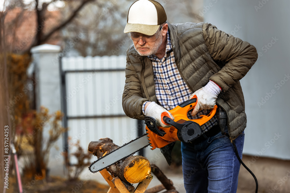 Man cutting wood with saw, dust and movements. Chainsaw. Man cutting wood with saw, dust and movements. Chainsaw.