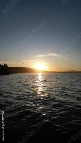 Aerial video of Lake Villarrica at sunrise in Pucon Chile photo