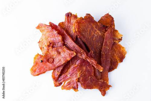 Beef jerky pieces isolated on a white and black background