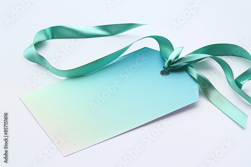 Elegant blank gift tag with a gradient design and teal ribbon, perfect for present decoration, invitations, and special occasions.