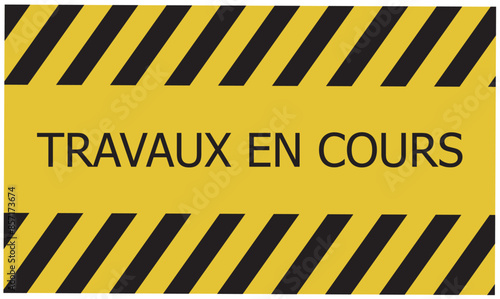Travaux en cours text on white background. Work continues in French.