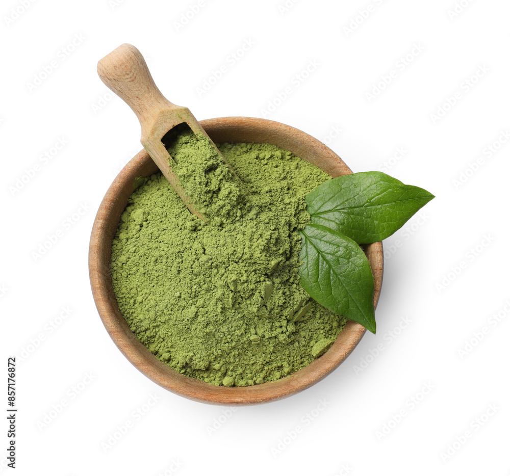 Green matcha powder in bowl, scoop and leaves isolated on white, top view Green matcha powder in bowl, scoop and leaves isolated on white, top view