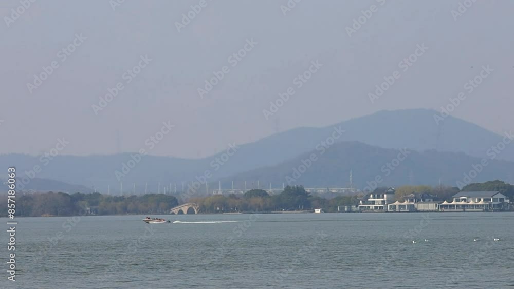 March 4, 2023, the sunset scenery of Taihu Lake in Yuantouzhu, Wuxi City, Jiangsu Province March 4, 2023, the sunset scenery of Taihu Lake in Yuantouzhu, Wuxi City, Jiangsu Province