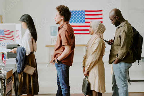 Принти на полотні Medium long side view shot of ethnically diverse young people standing in line t