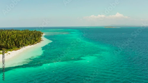 Sandy beach and tropical island by atoll with coral reef, top view. Patongong Island with sandy beach. Summer and travel vacation concept. photo