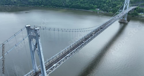 Aerial video of the Franklin Delano Roosevelt Mid-Hudson Bridge over the Hudson River, Poughkeepsie NY.  Panning, pan, camera movement. 	