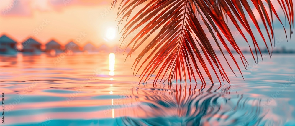 Beautiful tropical beach with palm leaves and sunset sky,summer vacation and travel concept. Beautiful tropical beach with palm leaves and sunset sky,summer vacation and travel concept.