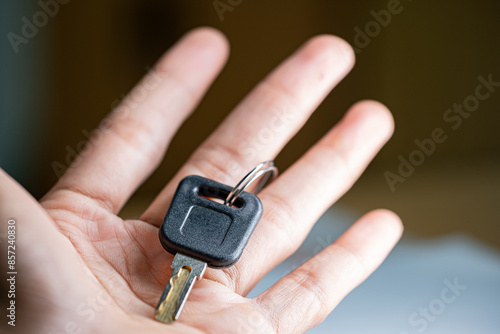 Hand holding a car key