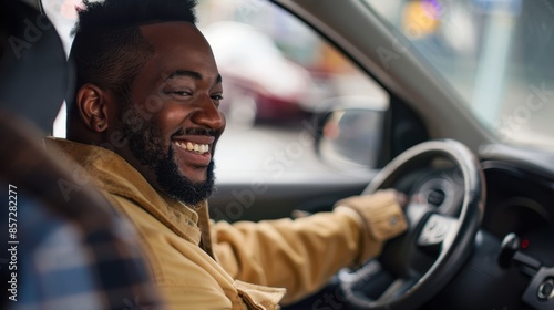 Smiling man driving a car, expressing joy and happiness behind the wheel. Urban commute in a cozy jacket on a busy city street.