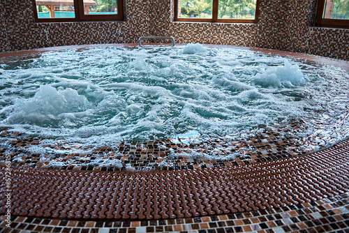 Clean water with bubbles in the jacuzzi. Rest in the spa. Selective focus