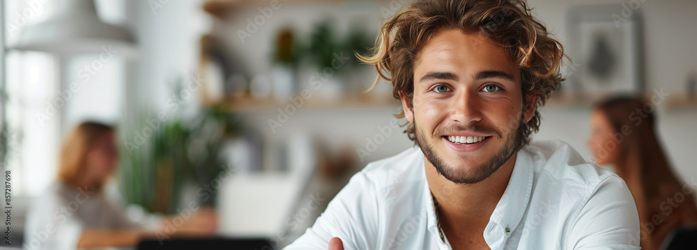 Young man giving thumbs-up and holding laptop on white background Young man giving thumbs-up and holding laptop on white background
