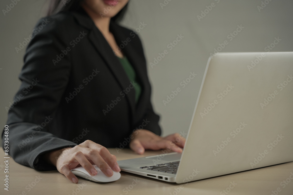 Close up of business woman hands typing on laptop computer, searching and surfing the internet on office desk, online working, telecommuting, freelancer at work concept Close up of business woman hands typing on laptop computer, searching and surfing the internet on office desk, online working, telecommuting, freelancer at work concept