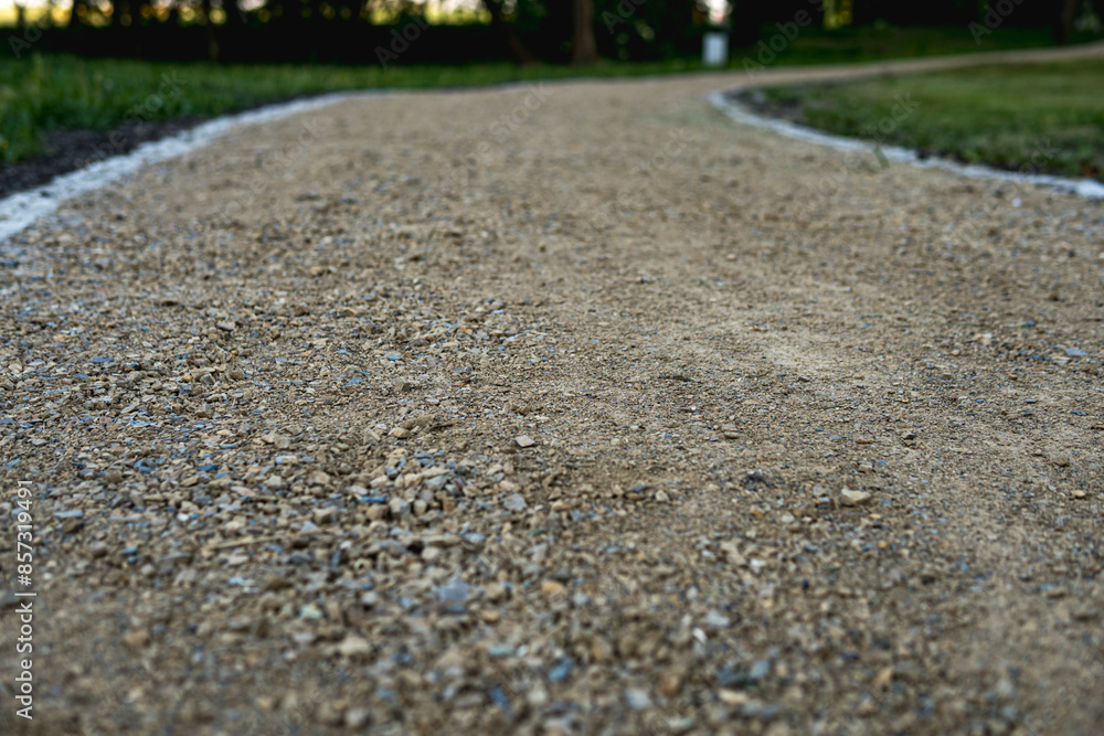 Ground path through a park made of small rocks Ground path through a park made of small rocks