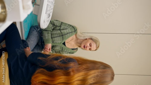 vertical video the clinic a young blonde girl at an appointment with a gynecologist consultation before the examination