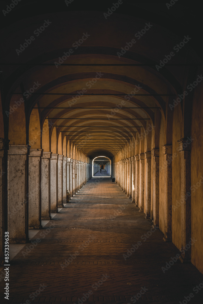 Dark tunnel perspective. Grunge architecture, old corridor in shadow.