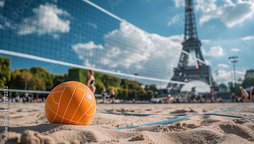 close-up of an orange volleyball on sandy court in Paris, with Eiffel Tower in the background, Summer Olympics photo