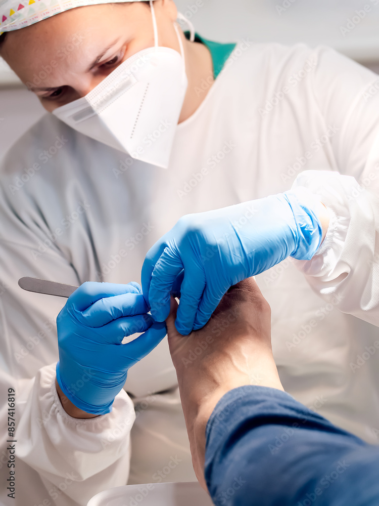 Female podiatrist doing chiropody in her podiatry clinic. Selective focus Female podiatrist doing chiropody in her podiatry clinic. Selective focus