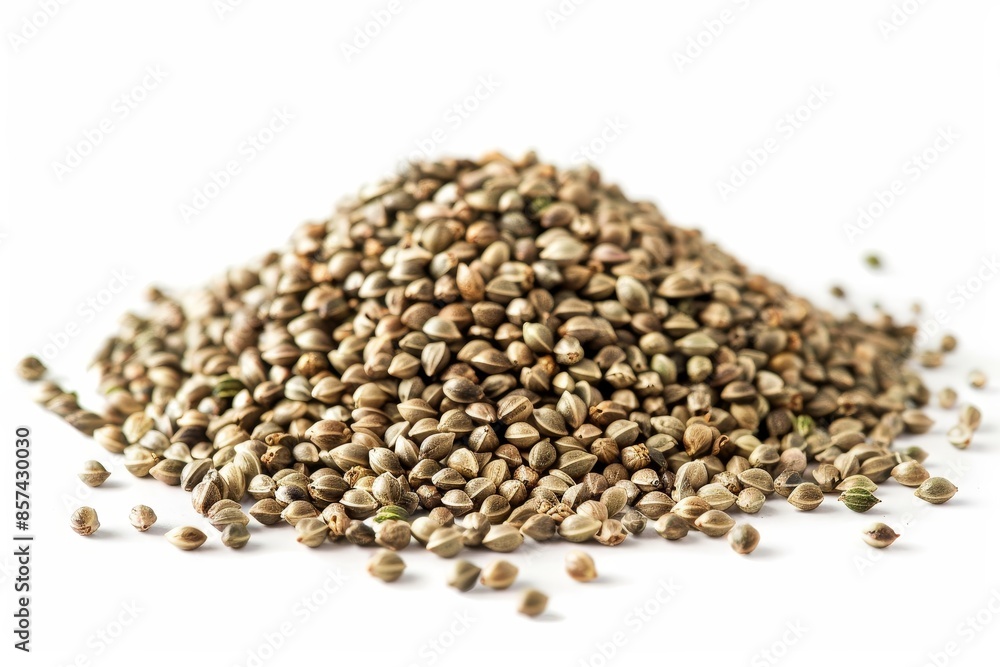 Pile of hemp seeds on white surface Pile of hemp seeds on white surface