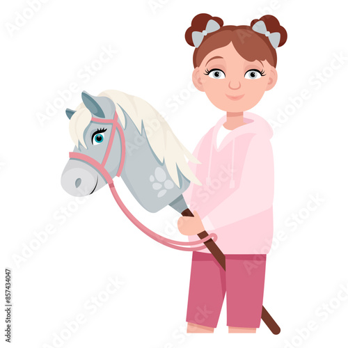 Cute girl with a toy horse head in her hands for hobbyhorsing