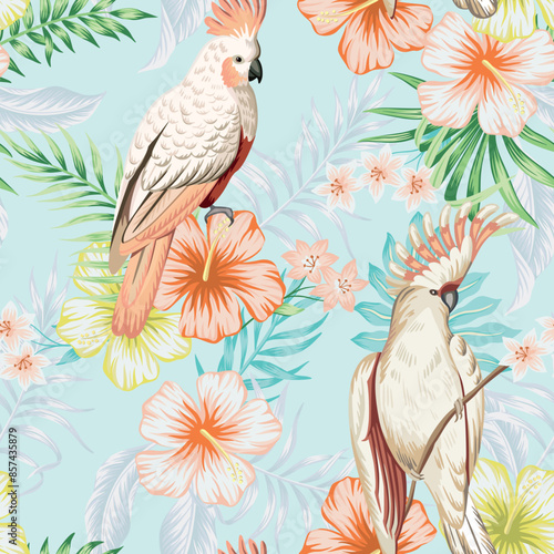 Tropical vintage palm leaves, pink hibiscus flower, pink cockatoo parrot floral seamless pattern blue background. Exotic jungle wallpaper.