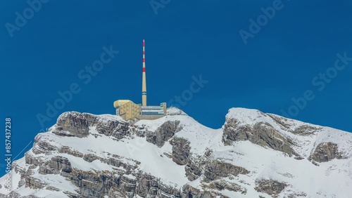 Time lapse, transmission tower, observation deck on the top of the mountain peak. Säntis mountain peak, Appenzell Alps, Switzerland photo