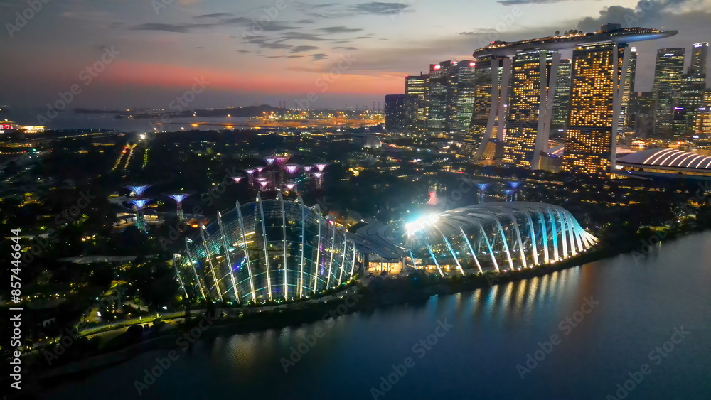 Obraz premium Singapore and Marina Bay skyscrapers. Aerial view at night from drone