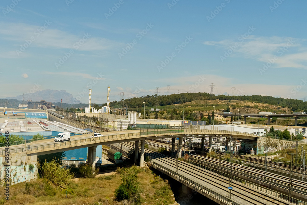 Industrial Landscape With Highway Overpass and Rail Tracks During Daytime Industrial Landscape With Highway Overpass and Rail Tracks During Daytime