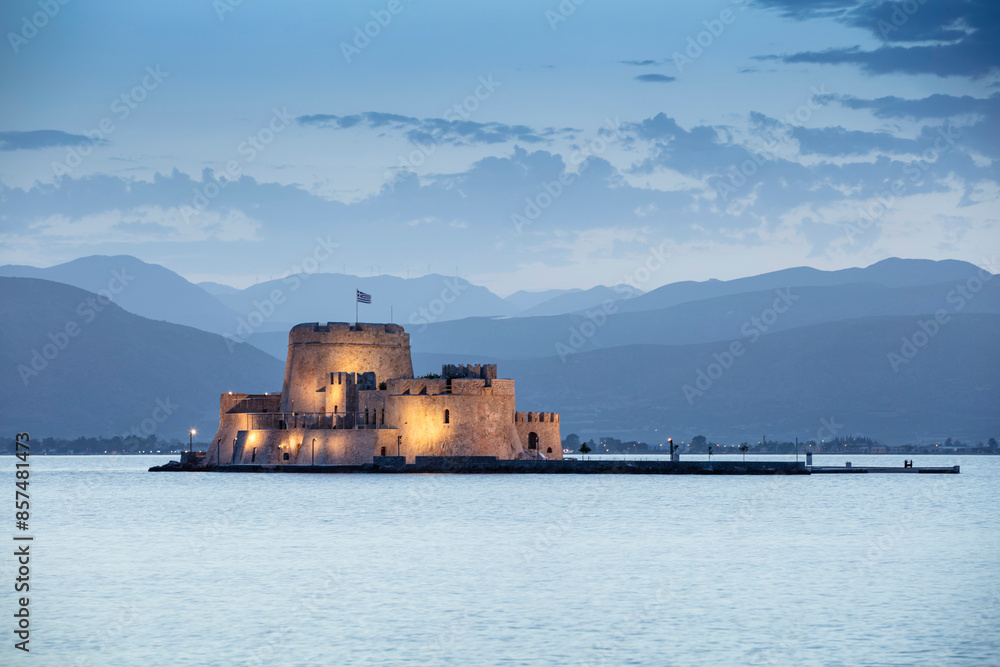 Venetian Castle of Bourtzi in the Bay of Nauplion at the dusk, Greece Venetian Castle of Bourtzi in the Bay of Nauplion at the dusk, Greece