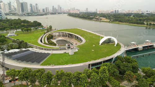 Singapore - September 13, 2023: Aerial view of Marina Barrage cityscape and coastline on a overcast afternoon