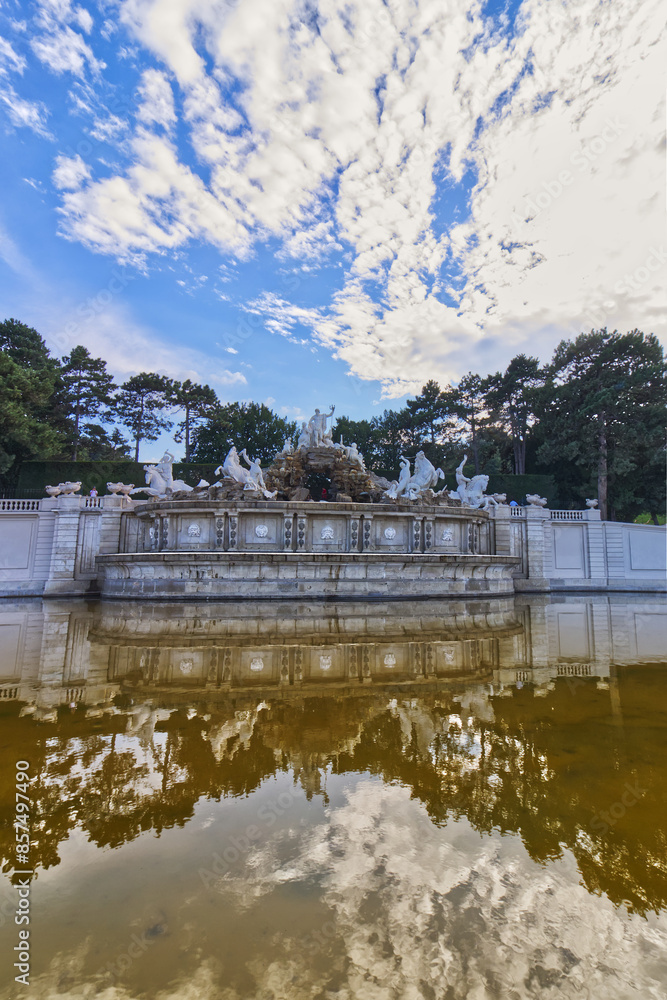 Fototapeta premium Beautiful clouds and blue sky over the man made sculpture Vienna, Austria