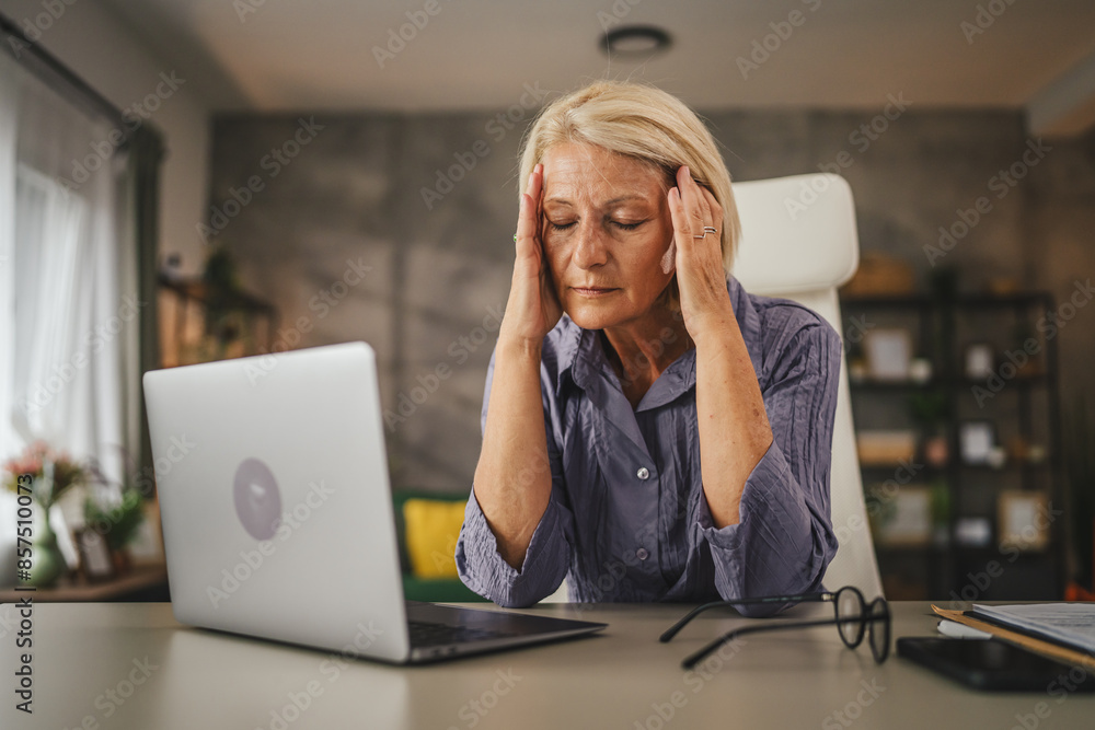 Mature senior woman work from home and have migraine headache pain Mature senior woman work from home and have migraine headache pain