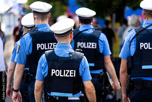 german police officer patroling outdoors background photo