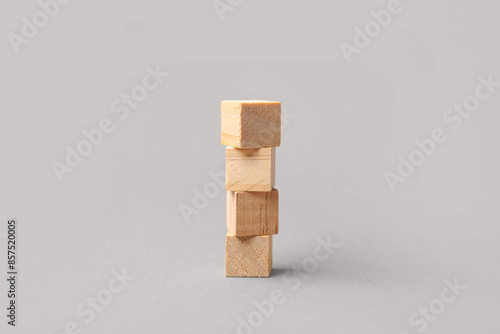 Blank wooden cubes on grey ...