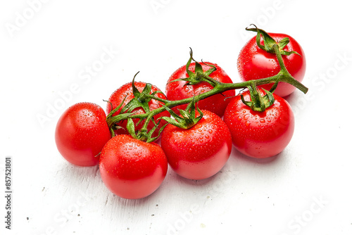 Cherry tomatoes with water droplets on white wooden textured background. Close-up of cherry tomatoes.